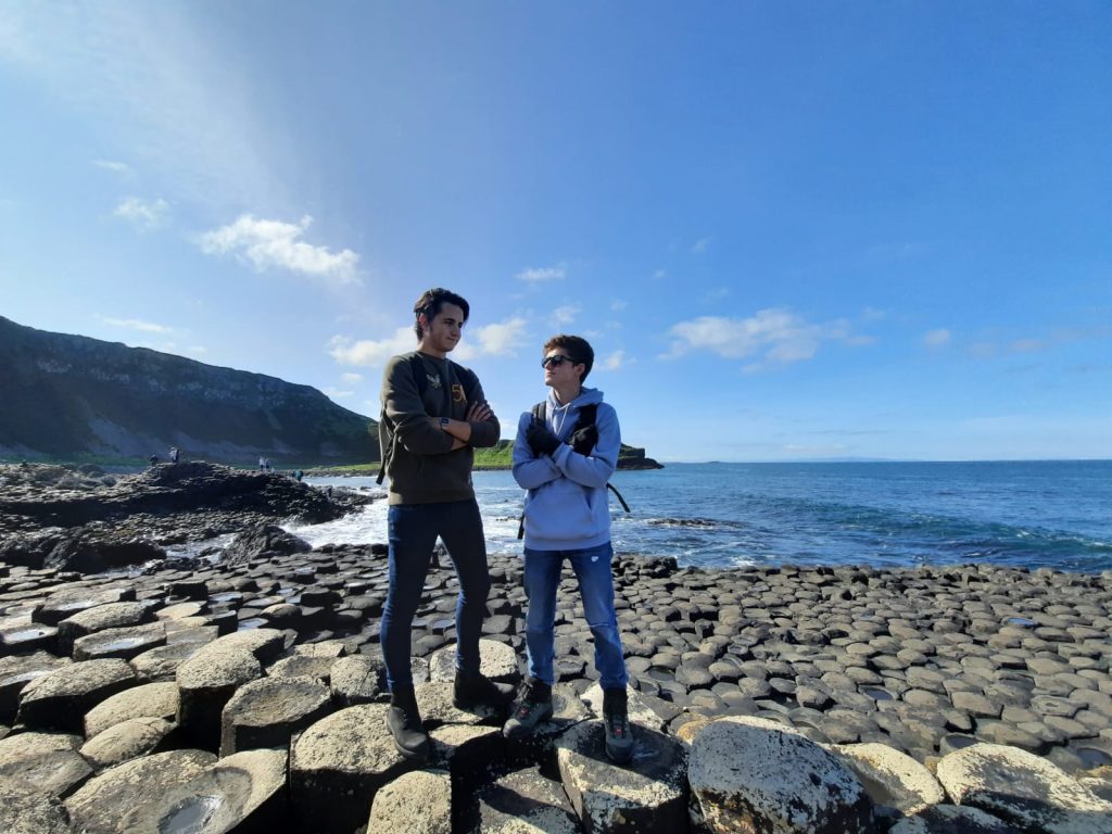 ITalian tudents at Giants Causeway in northern ireand on a sunny day